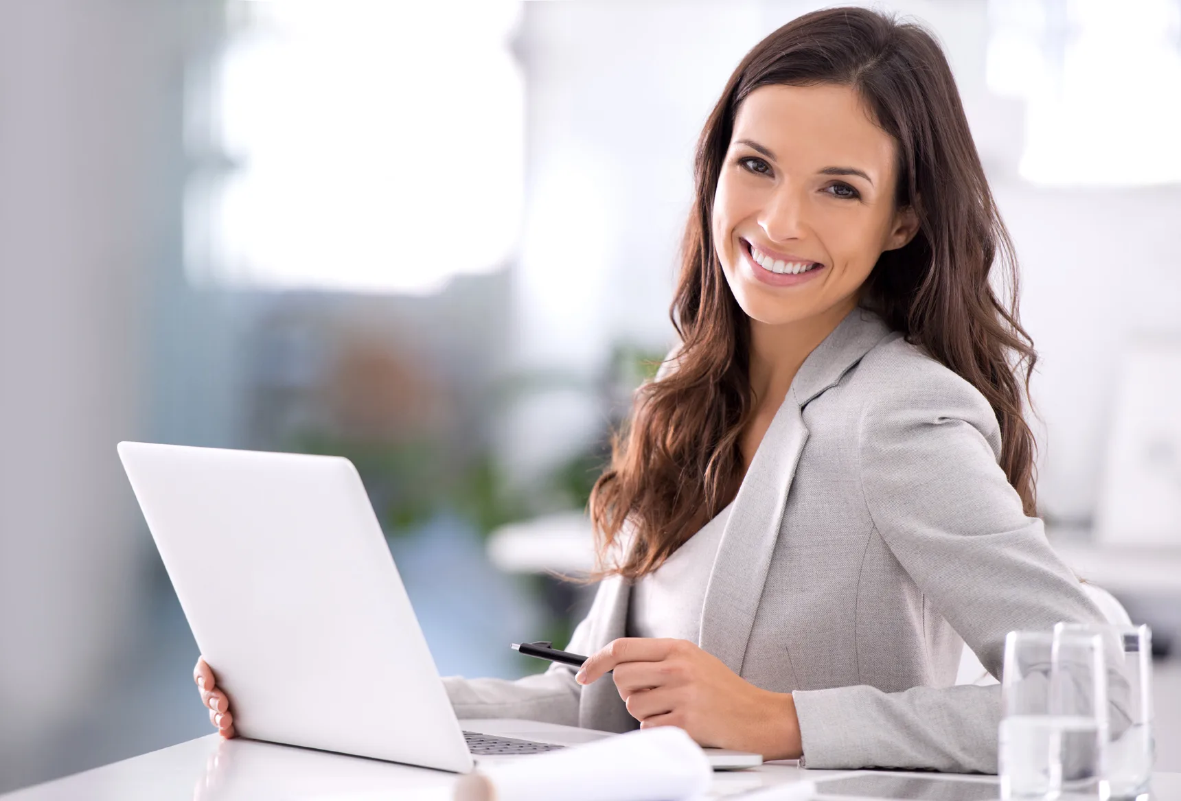 VOXY-AI-Voice_Mature-female-executive-sitting-at-office-desk_Vocal-Icon_72dpi_Vocal-copyright-2024
